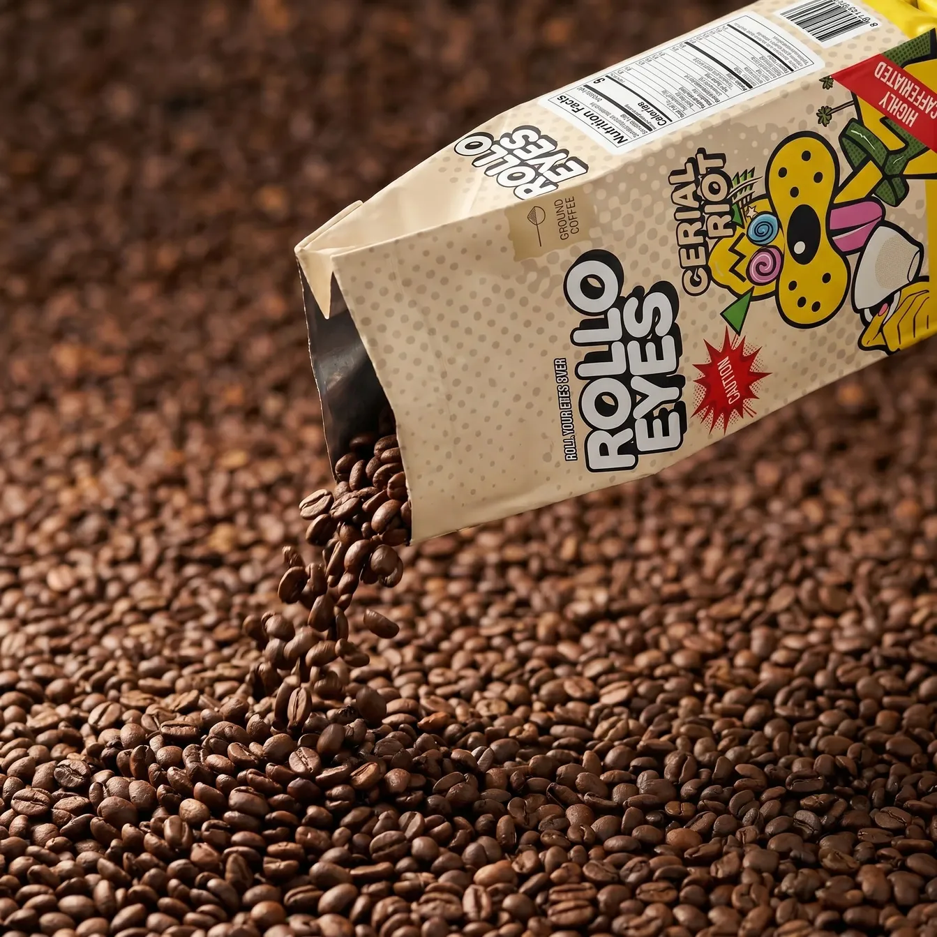 The Rollo Eyes Cereal Riot ground-coffee bag pouring roasted beans onto a bed of coffee beans
